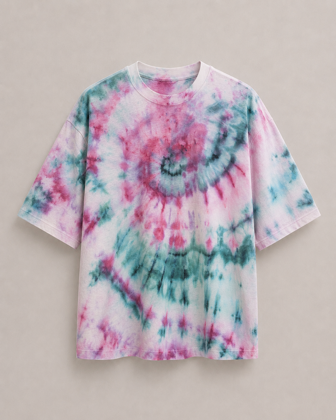 A short-sleeve t-shirt featuring a vibrant pink, teal, and white spiral ice dyed pattern, displayed flat against a neutral beige background. Hemp Horizon