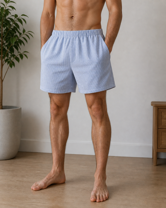 Man wearing light blue boxer shorts standing in a room relaxed. Hemp Horizon