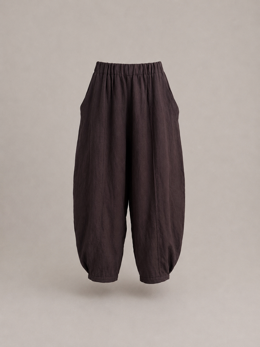 Dark brown baggy barrel pants with an elastic waistband, displayed on a neutral beige. Hemp Horizon