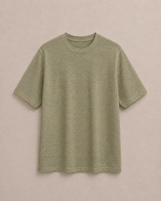 A short-sleeve pure Hemp t-shirt in a light Olive color, laid flat against a solid light beige background. Hemp Horizon