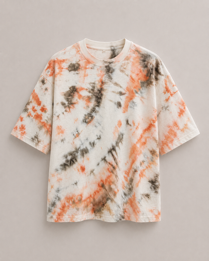 A short-sleeve ice dyed t-shirt with an orange and brown dye twirl pattern, displayed flat against a neutral gray background. Hemp Horizon