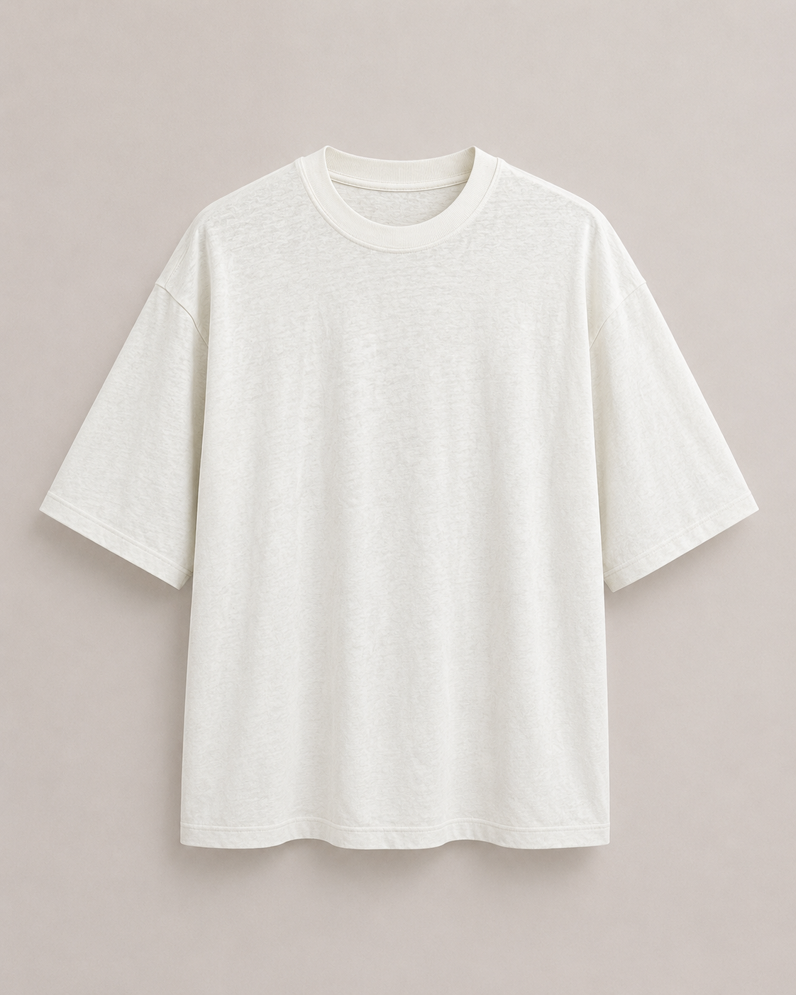 A plain natural short-sleeve boxy crewneck t-shirt displayed flat against a solid, light beige background.