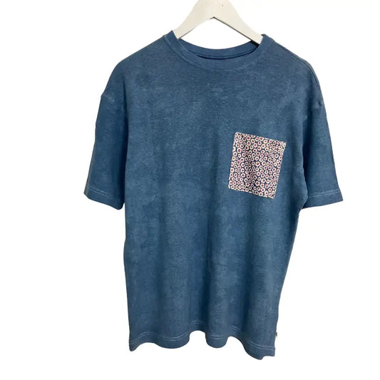 Deep blue hand-finished hemp and organic cotton pocket tee with faded textured fabric and geometric pink beige patch