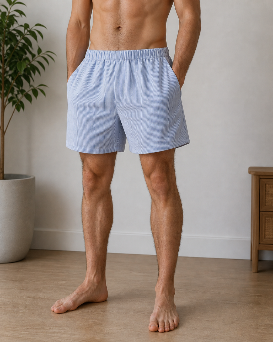 Man wearing light blue boxer shorts standing in a room relaxed. Hemp Horizon